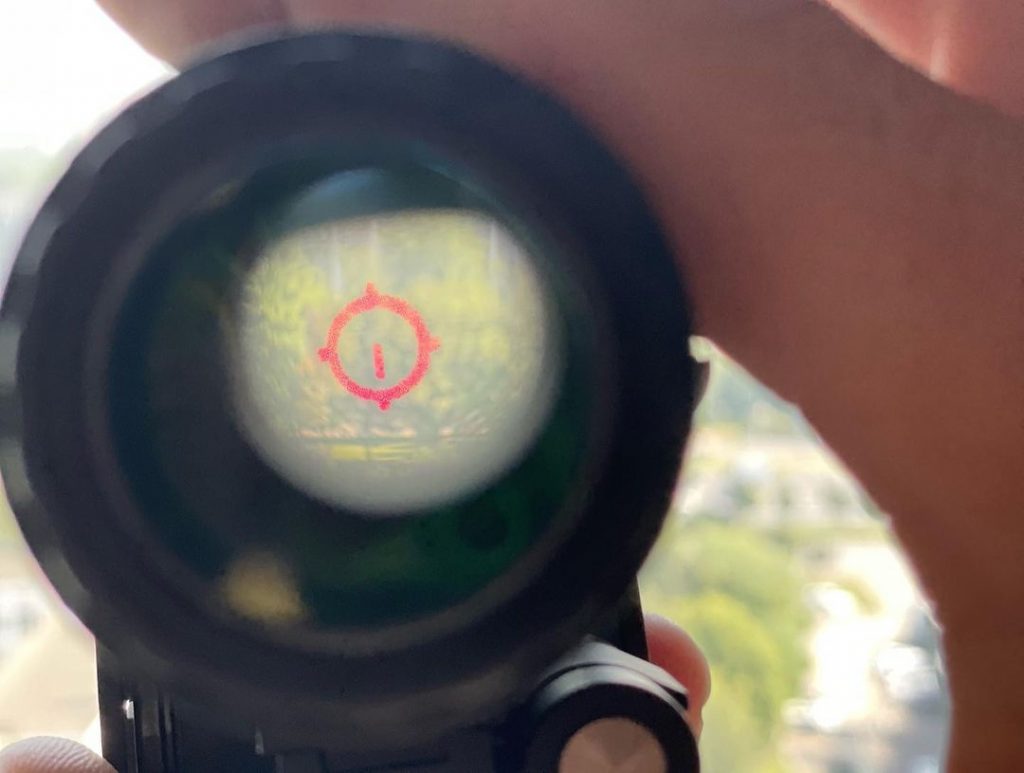 holographic sight projects a dot-like image onto the glass